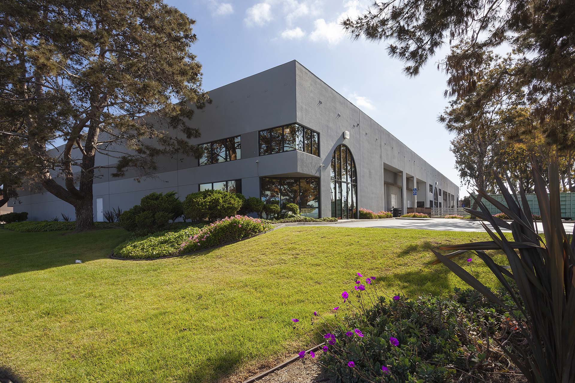 Block Distribution Center commercial building with lush landscaping.
