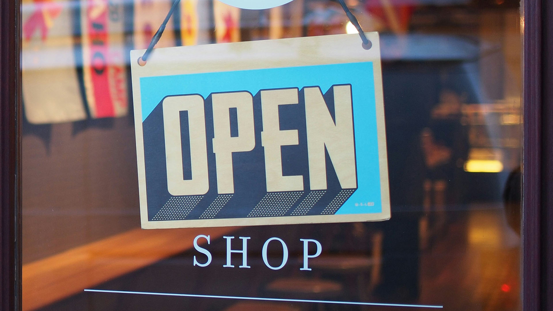 Open sign on boutique door.
